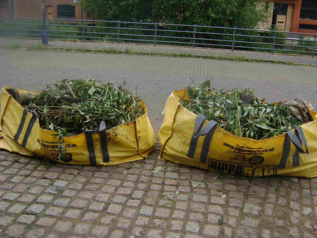 The layer of vegetation in each bag hides the fact that each one is two thirds full of rubble that was lifted out of the goit.